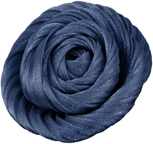 Dark blue fabric petals shaped by hand into a rose, fitted with both a brooch pin and a hair clip.