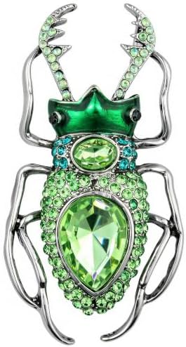 Green rhinestones set on a cast metal beetle base, finished with a sturdy rollover clasp on the reverse.
