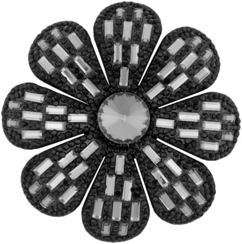 A black fabric flower set with glass rhinestones, built with both a pin stem and an alligator clip on the base.