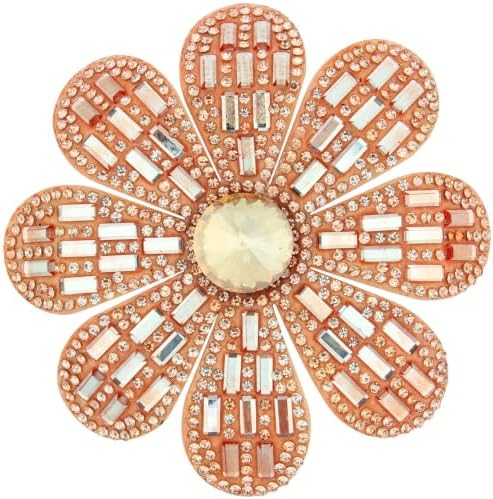 Built on our flower bench with layered fabric petals and glass rhinestones, this champagne piece pins to a lapel or clips into hair.