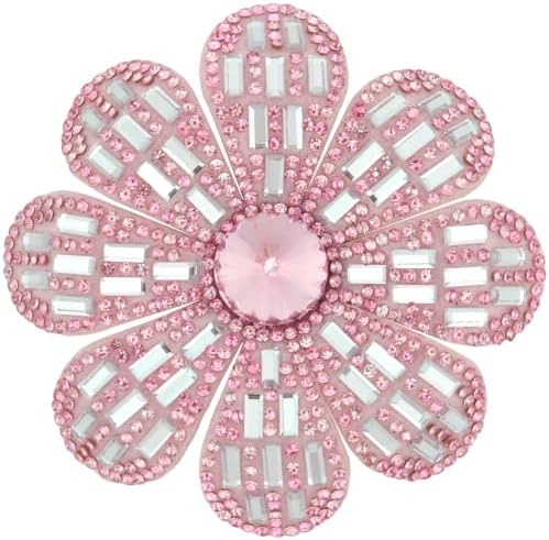 A layered pink flower set with glass rhinestones, built with both a pin stem and an alligator clip on the reverse.