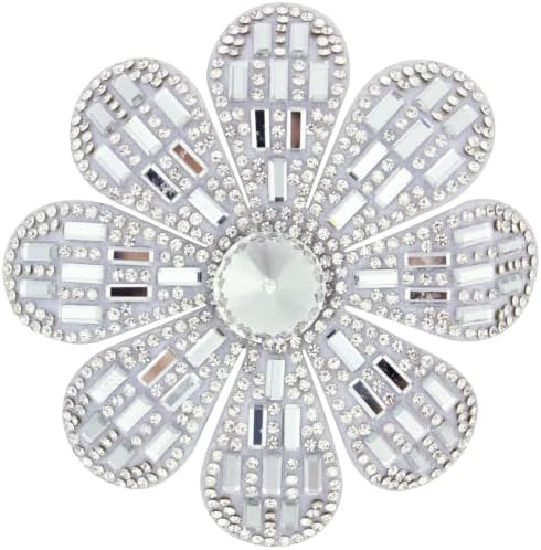 Layered white fabric petals centered with glass crystal rhinestones, fitted with both a pin stem and a hair clip back.