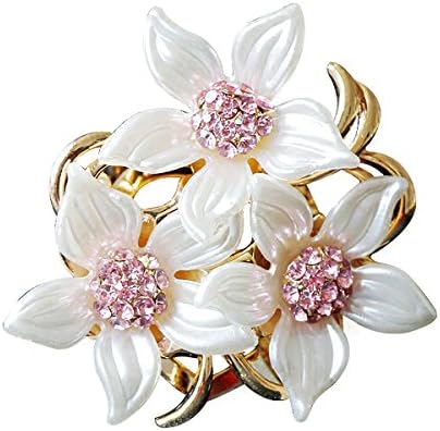 Three flower heads set with created crystal and created cat eye stones on a sturdy alloy pin back.